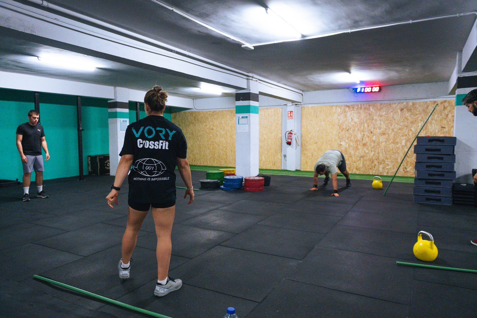 Personal trainer coaching athletes on the gym floor